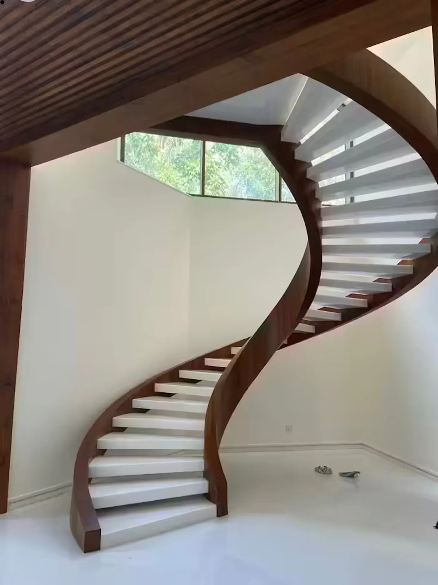 Floating stair retrofit installation in an industrial Miami loft